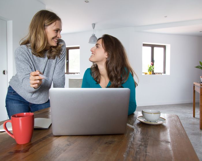 cheerful-female-friends-watching-discussing-media-content (Demo) (Demo)