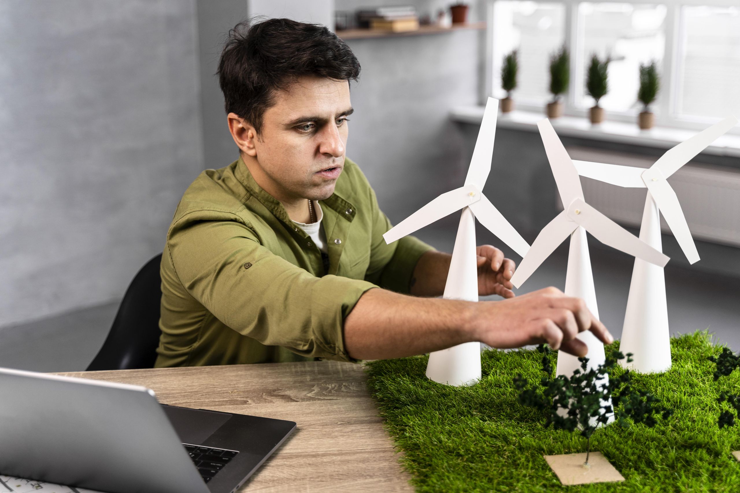 man-working-eco-friendly-wind-power-project-with-wind-turbines